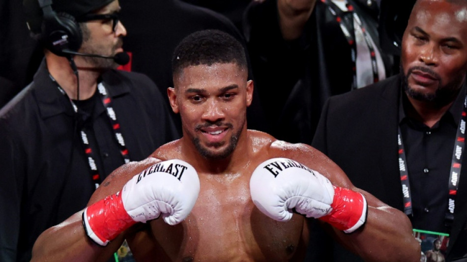 Joshua returns to Britain after fatal crash in Nigeria