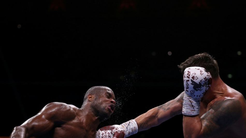 Dubois climbs off the canvas to become two-time world heavyweight champion