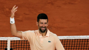 Djokovic comes from behind to keep Roland Garros bid alive