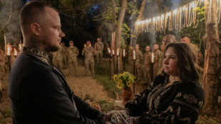 Amid war, Ukrainian soldiers celebrate love at ritual wedding