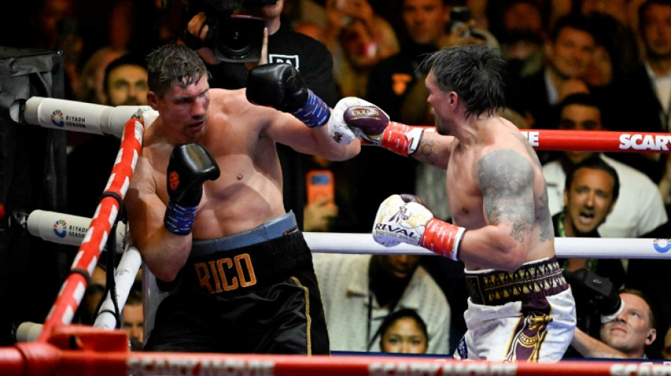 Usyk rocked before stopping Verhoeven to retain heavyweight belts