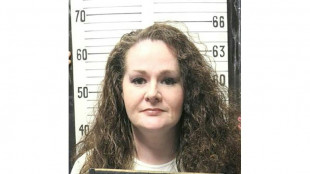 After botched execution, US woman is awake and shackled to bed