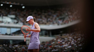 'Super tense' Swiatek falls in bid to regain French Open crown